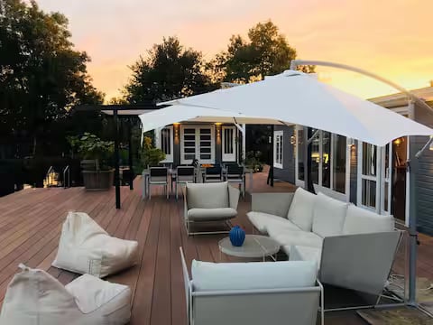 Lounge in golden-hour — before HostRev